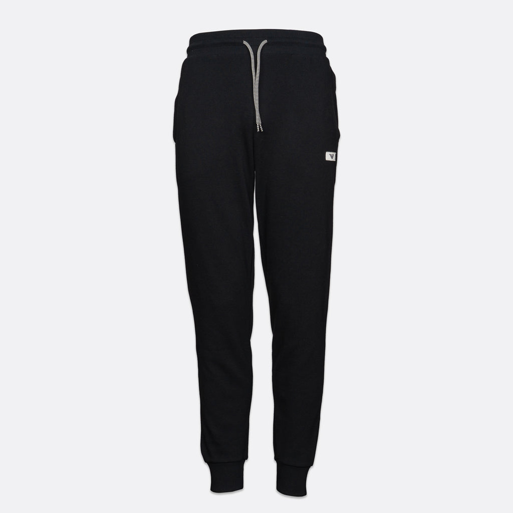 Black sweatpants with a light gray drawstring and a small white logo patch on the left thigh, shown against a light gray background. Emporio Armani Joggers available at Sakks Menswear in Southampton.