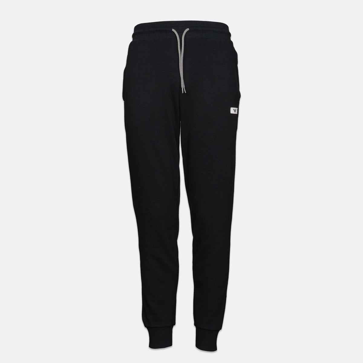 Black sweatpants with a light gray drawstring and a small white logo patch on the left thigh, shown against a light gray background. Emporio Armani Joggers available at Sakks Menswear in Southampton.