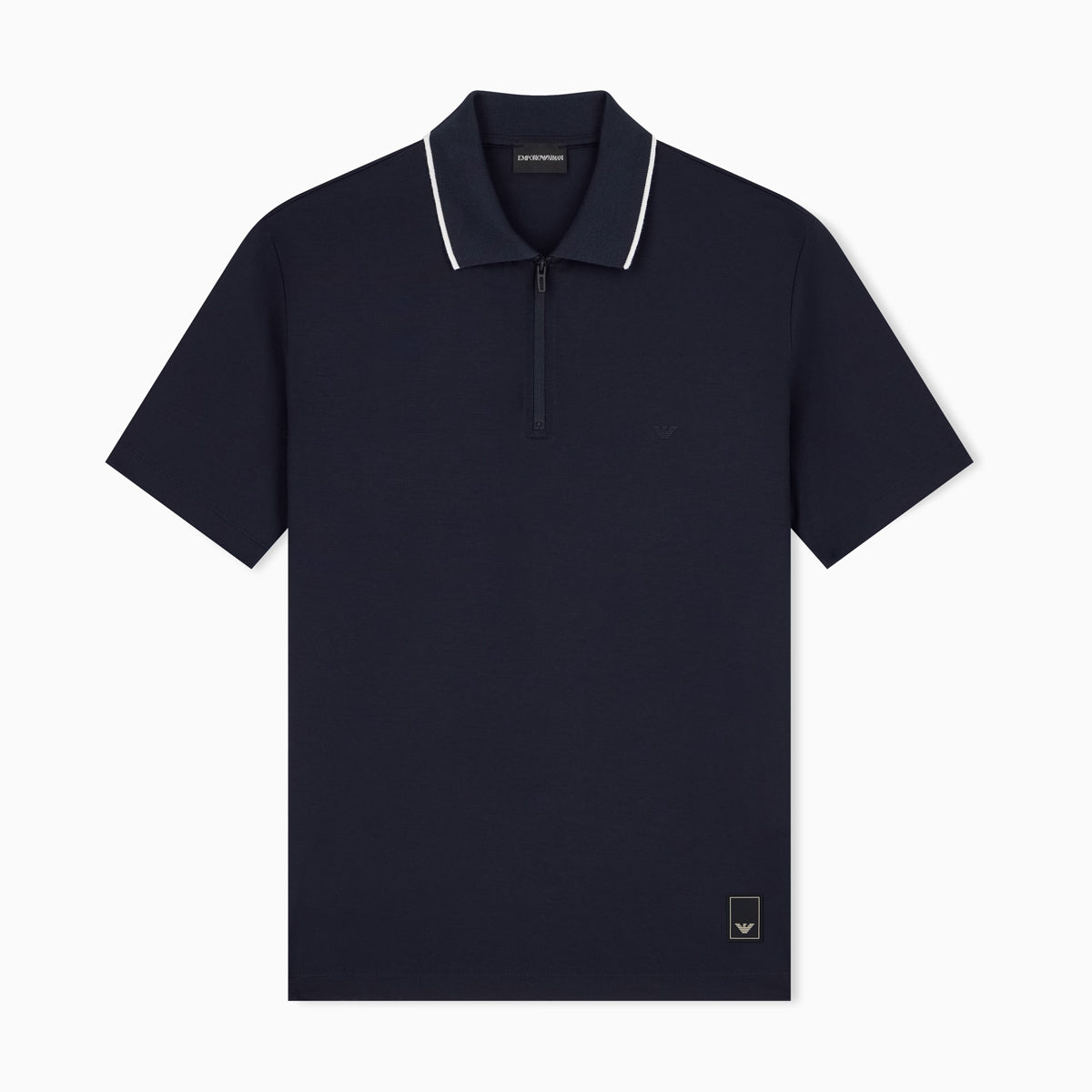 A navy blue short-sleeve polo shirt with a half-zip collar and white piping trim, shown flat against a light gray background. Emporio Armani Polo available at Sakks Menswear in Southampton.