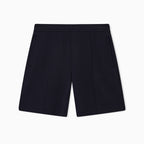 A pair of dark navy blue pleated shorts with side pockets, shown flat against a clean white background. Emporio Armani Shorts available at Sakks Menswear in Southampton.