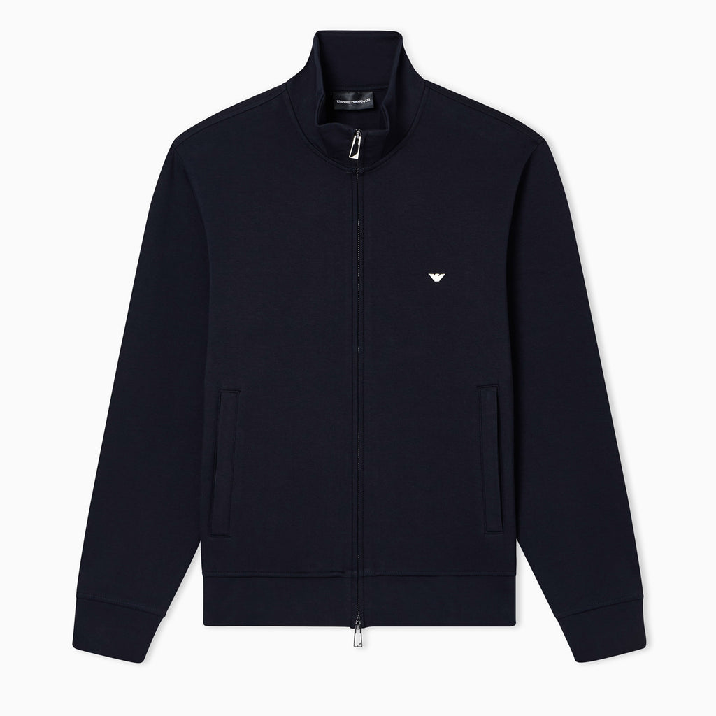 A dark navy blue zip-up jacket with a stand collar, featuring the embroidered Emporio Armani eagle logo on the left chest, displayed on a clean white background. Emporio Armani Sweatshirt available at Sakks Menswear in Southampton.