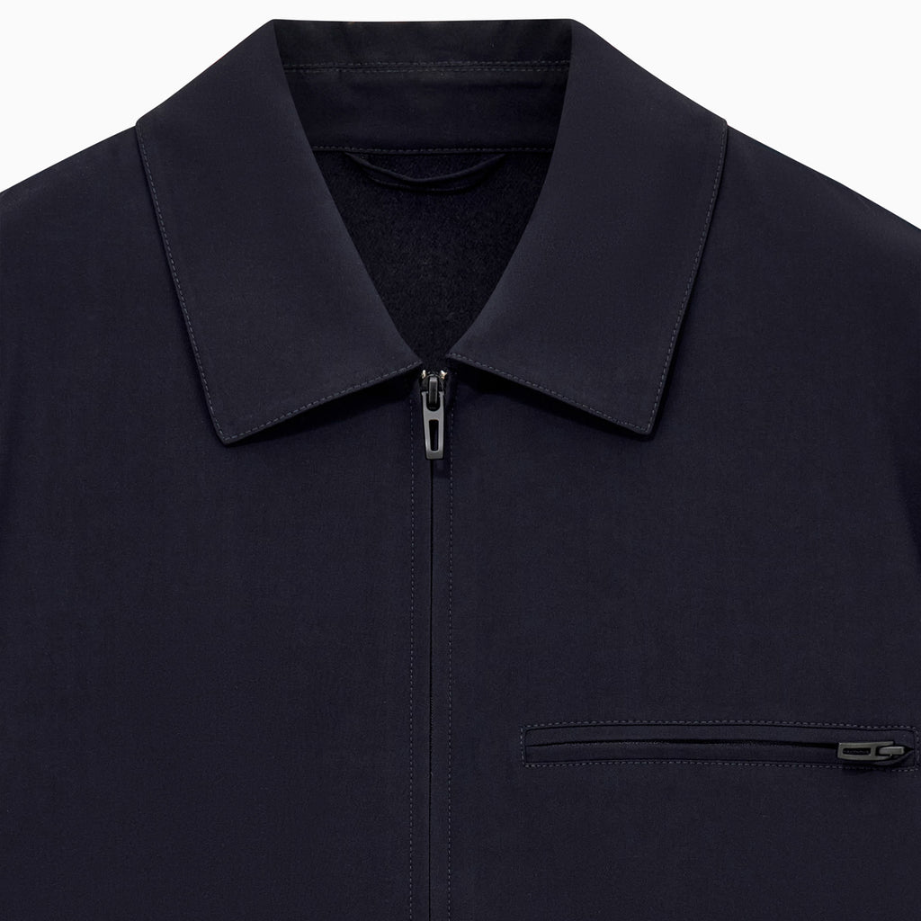 Navy Blue jacket with a collar and button details on a white background.  Emporio Armani Jacket available at Sakks Menswear in Southampton.