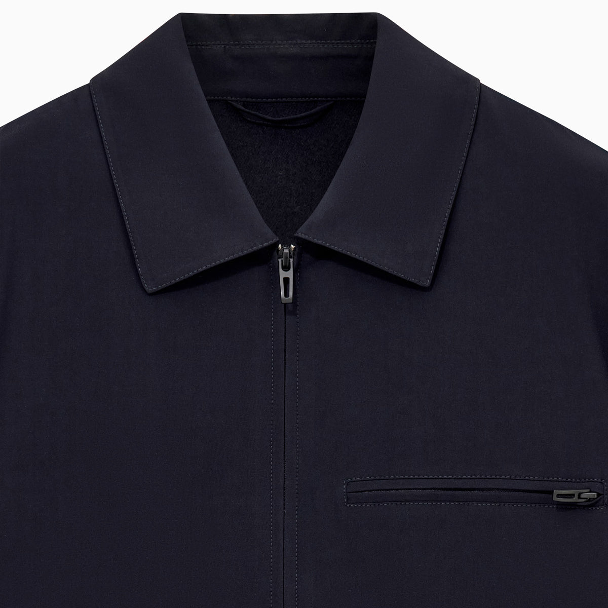 Navy Blue jacket with a collar and button details on a white background.  Emporio Armani Jacket available at Sakks Menswear in Southampton.