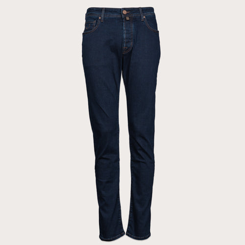 A pair of dark navy blue slim-fit jeans shown flat against a light gray background. Jacob Cohen Jeans available at Sakks Menswear in Southampton.
