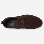 A single dark brown suede moc-toe shoe shown from a top-down view on a light gray background. The brand name 'Oliver Sweeney' is visible on the black interior footbed. Oliver Sweeney Moccasin's available at Sakks Menswear in Southampton.