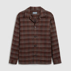 A brown and beige plaid button-up shirt jacket with a notch lapel, displayed flat against a light beige background. Oliver Sweeney Shirt Jacket available at Sakks Menswear in Southampton.
