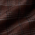 A close-up of a brown plaid fabric with a fine checkered pattern in dark brown, black, and light beige. Oliver Sweeney Shirt Jacket available at Sakks Menswear in Southampton.