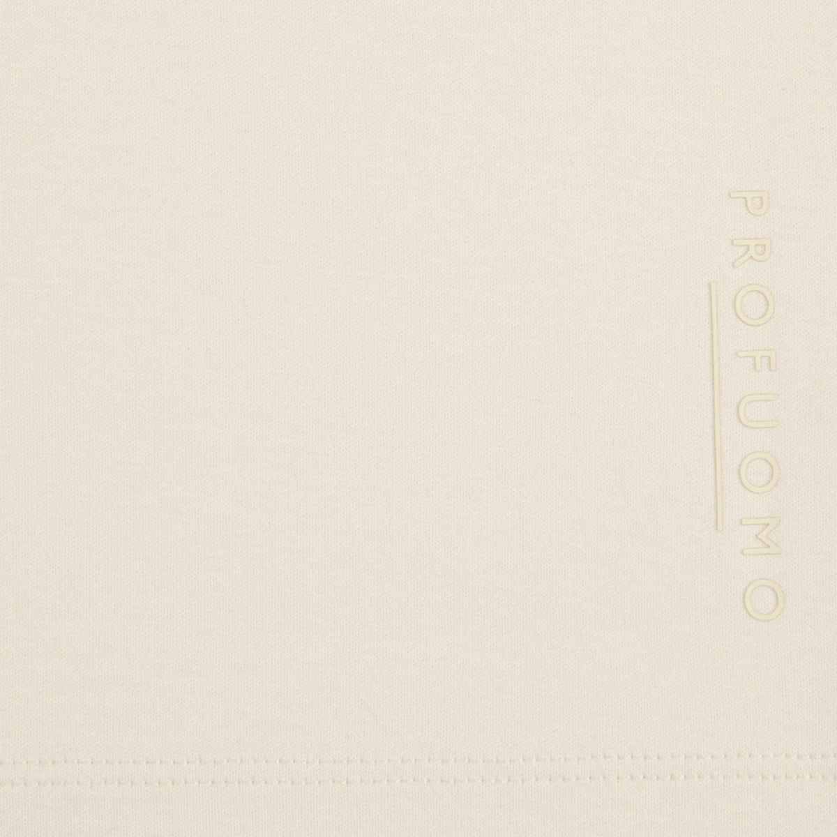 A close up image of a raw white pima cotton t-shirt with the branding spelling "PROFUOMO". Profuomo T-Shirts are available at Sakks Menswear in Southampton.