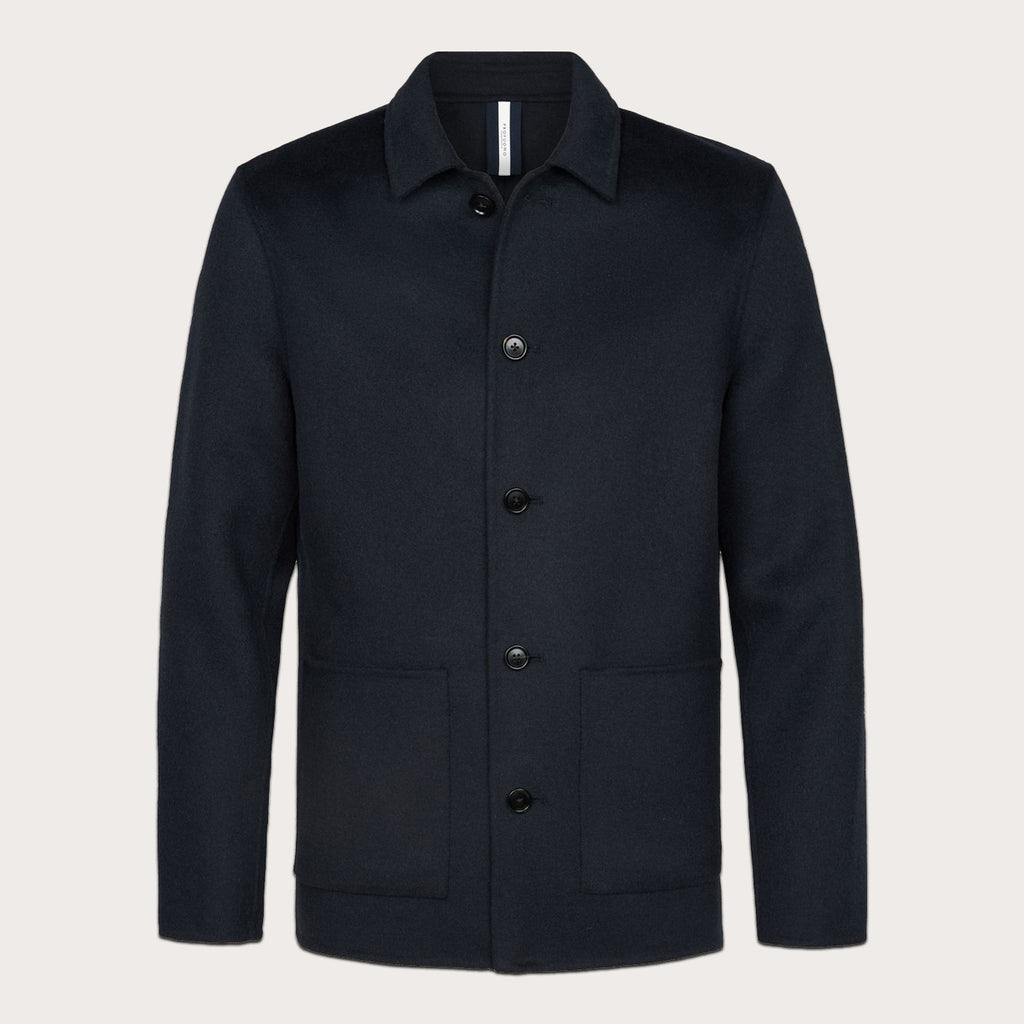 A dark navy blue wool-blend jacket with a buttoned collar, front button closure, and two front patch pockets, shown on a light beige background. Profuomo Coat available at Sakks Menswear in Southampton.