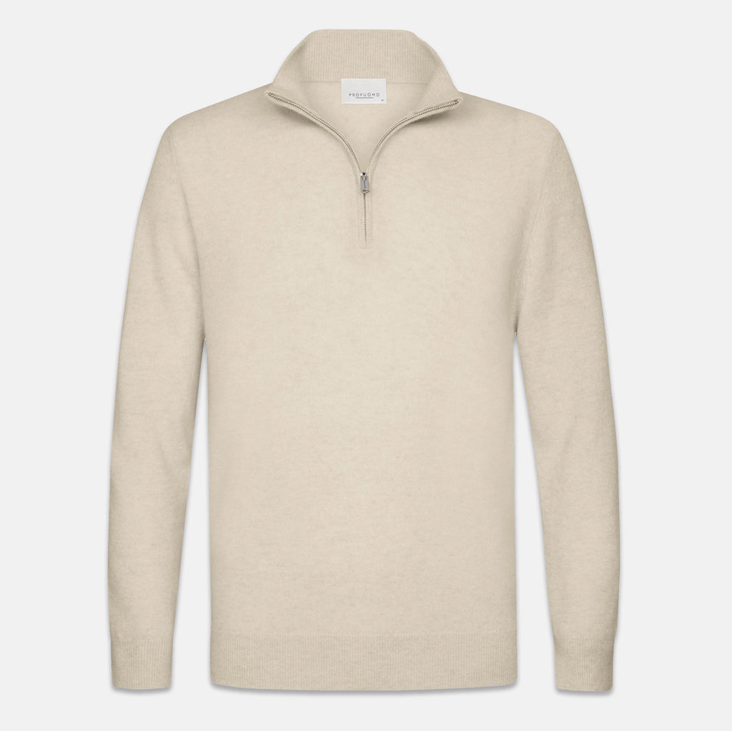 A light beige knit quarter-zip sweater with a stand-up collar and a silver zipper, shown against a plain light gray background. Profuomo knitwear available at Sakks Menswear in Southampton.