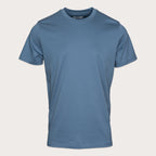 A short-sleeve crewneck t-shirt in a muted slate blue color, displayed on a clean, light beige background. Thomas Maine T-Shirts available at Sakks Menswear in Southampton.