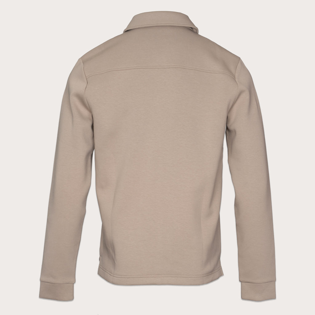 A light beige long-sleeve fleece pullover jacket shown from the back, featuring a collar and a horizontal seam across the upper back, set against a solid off-white background. Thomas Maine Sweats available at Sakks Menswear in Southampton.