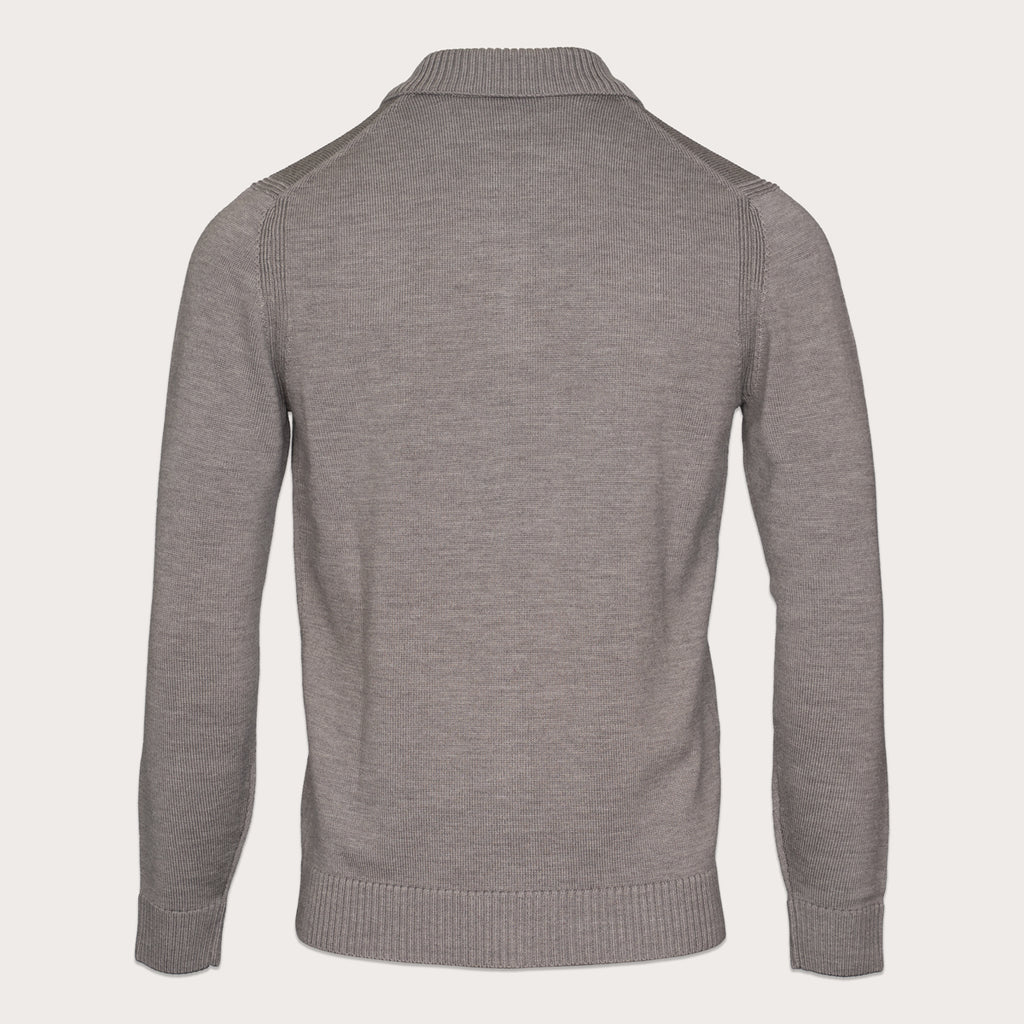 A heather gray knit sweater shown from the back, featuring a mock neck collar, ribbed cuffs, and ribbed hem, displayed on a clean off-white background. Thomas Maine Knitwear available at Sakks Menswear in Southampton.