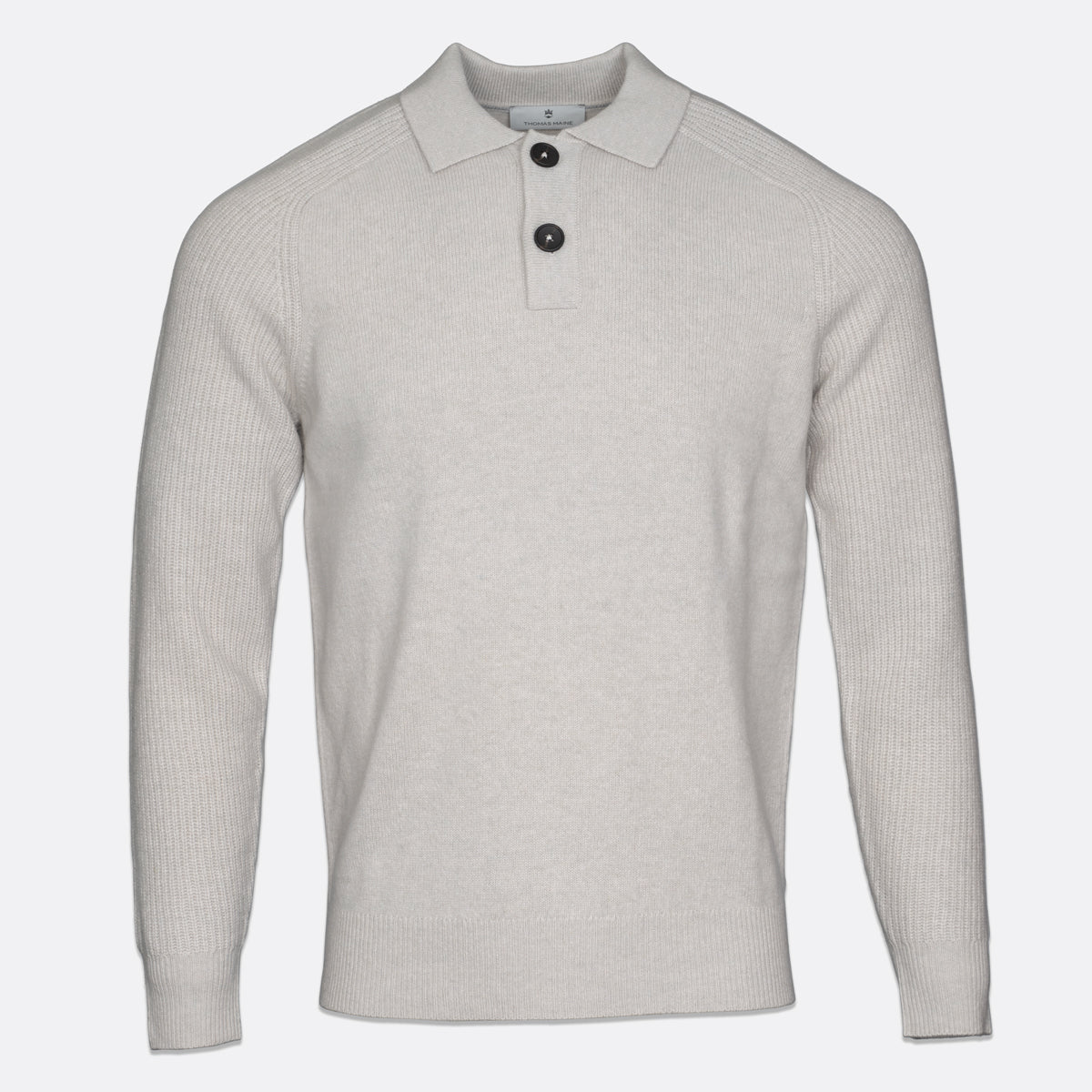 A light beige ribbed knit polo sweater with a two-button placket, displayed on a clean white background. Thomas Maine Knitwear available at Sakks Menswear in Southampton.