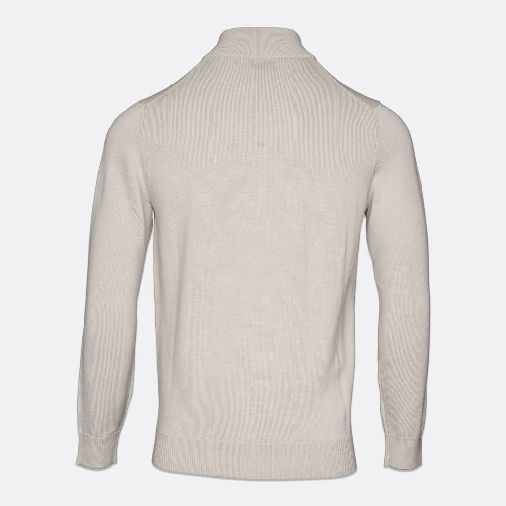 A light beige knit sweater shown from the back, featuring a mock neck collar, long sleeves, and ribbed cuffs and hem, set against a plain light gray background. Thomas Maine Knitwear available at Sakks Menswear in Southampton.