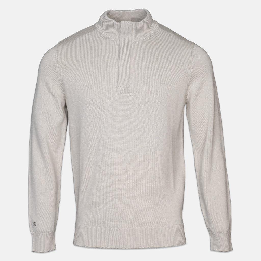 A light beige knit quarter-zip sweater with a mock neck collar, displayed on a clean, light gray background. Thomas Maine Knitwear available at Sakks Menswear in Southampton.