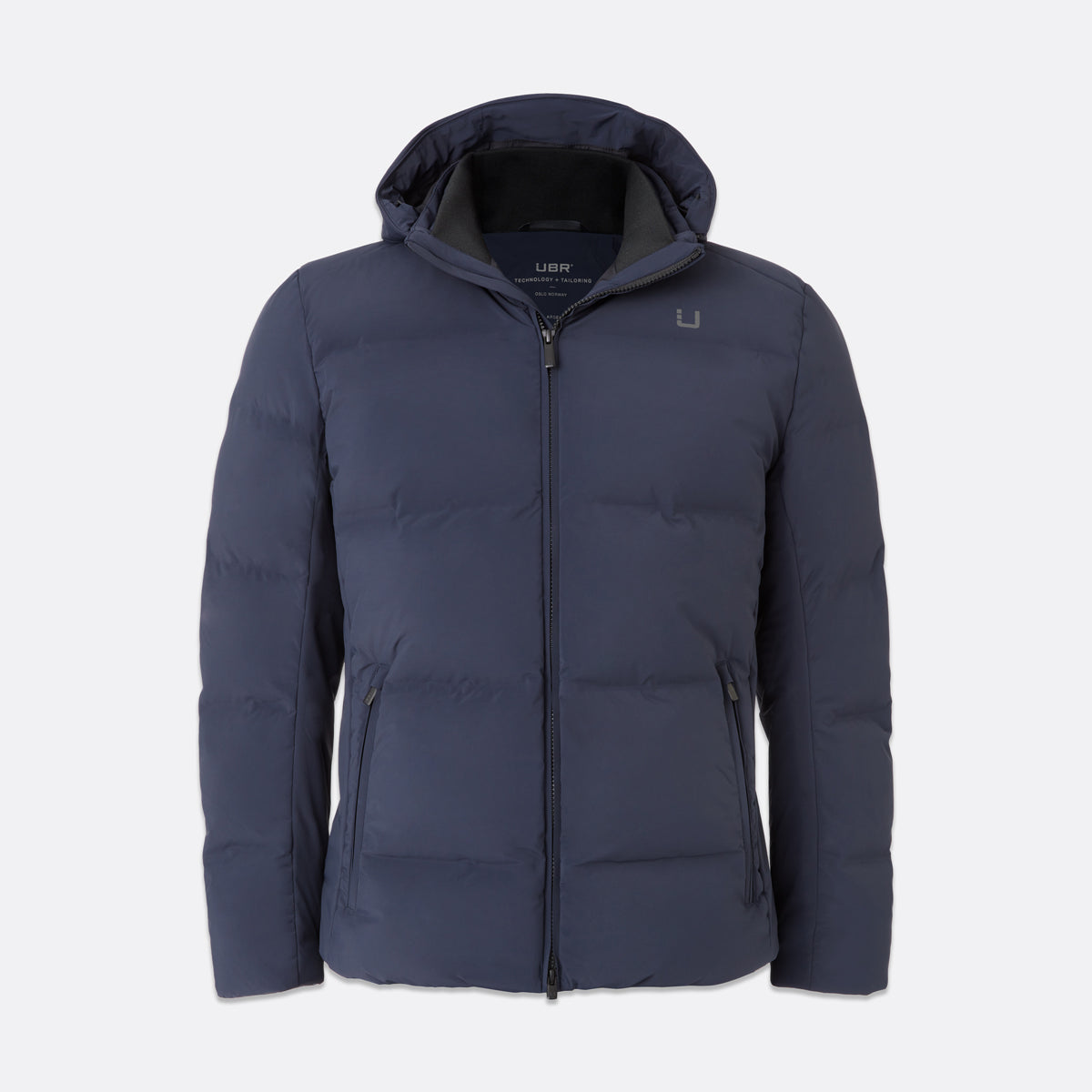 UBR Bolt Down Jacket in Navy displayed in front of a light grey background. UBR Jackets available at Sakks Menswear in Southampton.