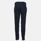 A pair of dark navy blue slim-fit trousers shown from the back, featuring a button closure and belt loops, set against a plain light gray background. Briglia 1949 Trousers available at Sakks Menswear in Southampton.