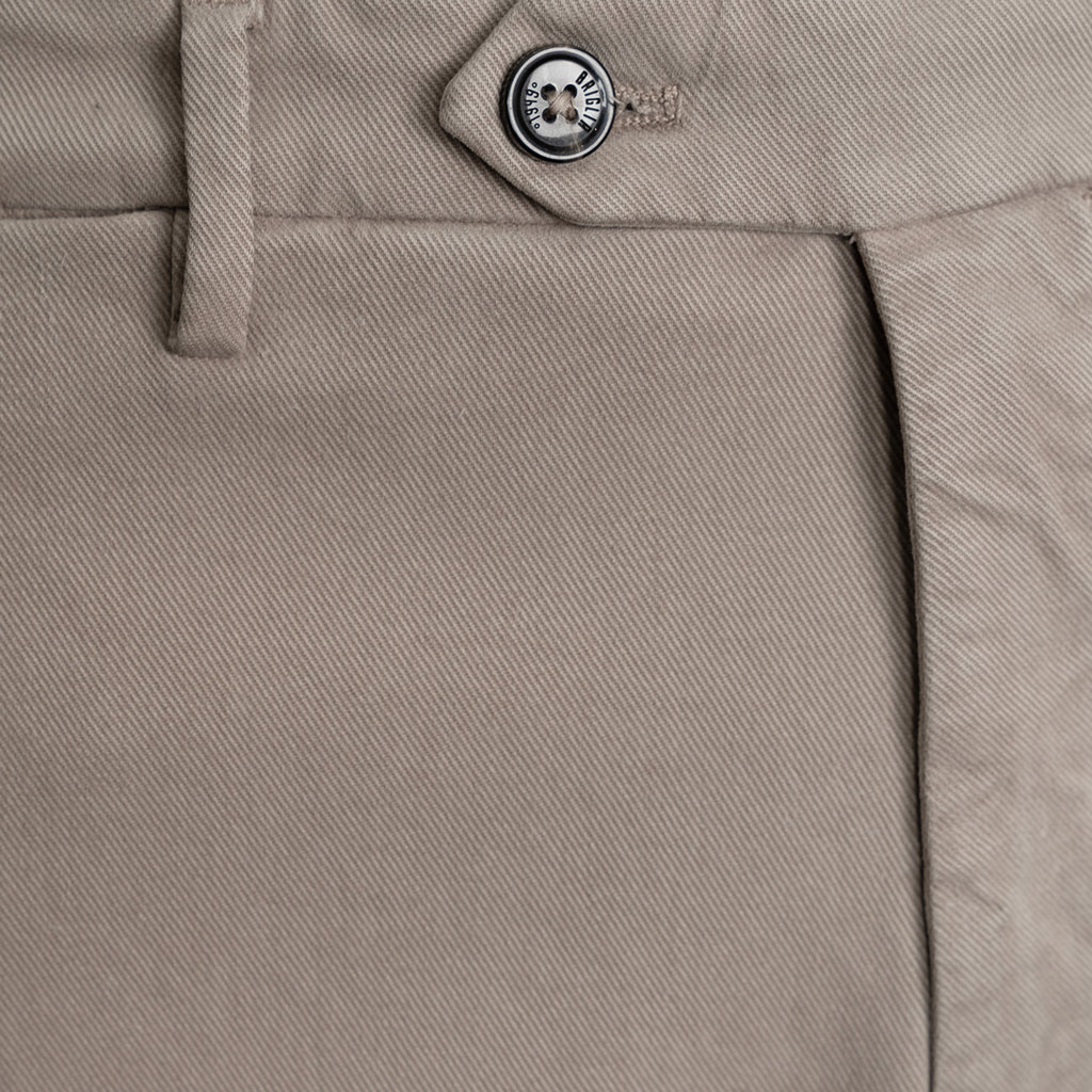 Close-up of khaki twill trousers showing the waistband, button closure, belt loop, and front seam. Briglia 1949 trousers available at Sakks Menswear in Southampton.