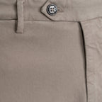 Close-up of khaki twill trousers showing the waistband, button closure, belt loop, and front seam. Briglia 1949 trousers available at Sakks Menswear in Southampton.