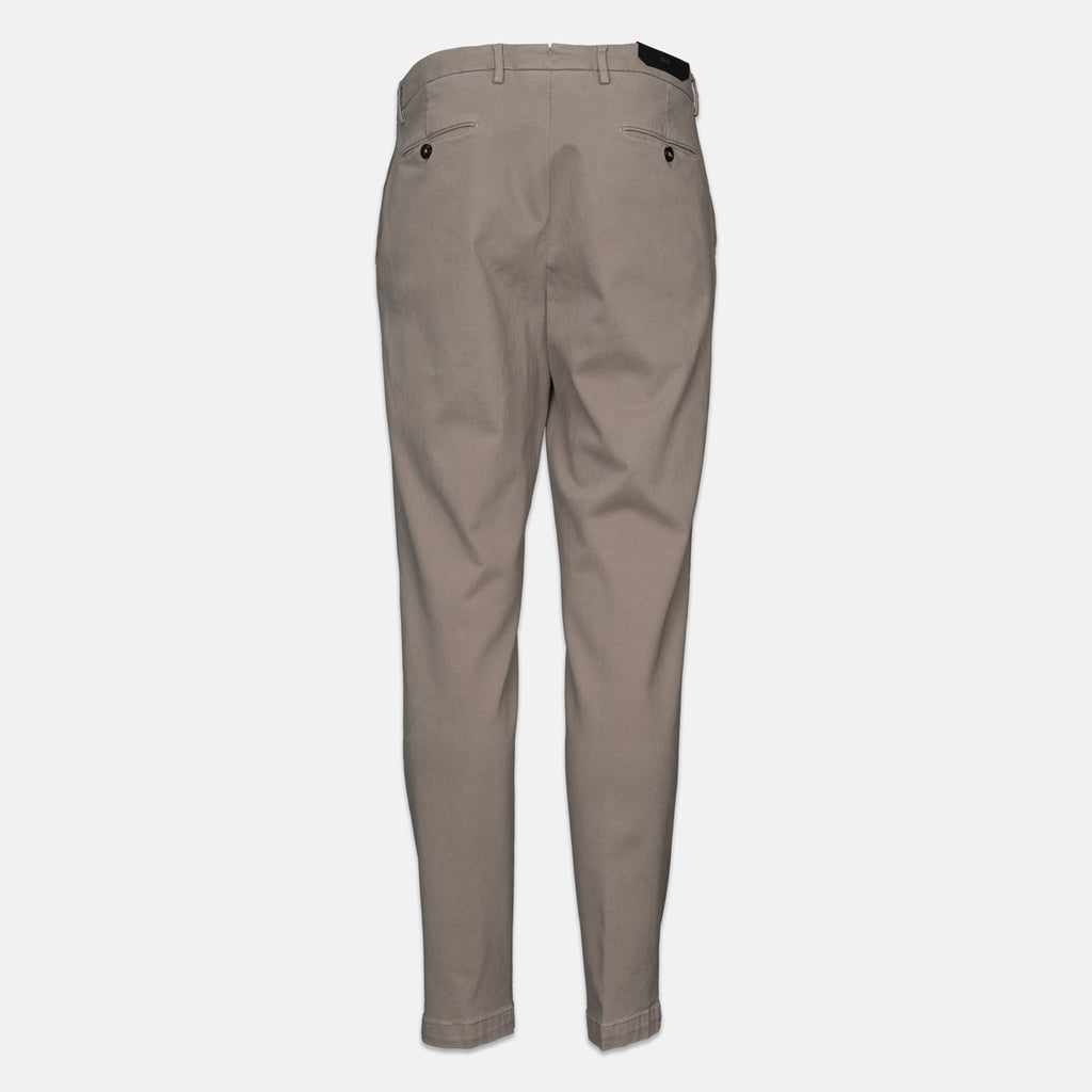 A pair of slim-fit chinos in a light taupe-beige color, shown from the back against a plain light gray background. Briglia 1949 trousers available at Sakks Menswear in Southampton.