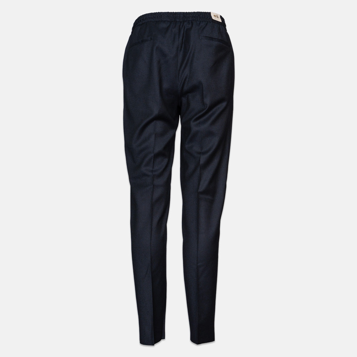 A pair of dark navy blue trousers shown from the back, featuring an elastic waistband and a small beige brand tag, set against a plain light gray background. Briglia 1949 Trousers available at Sakks Menswear in Southampton.