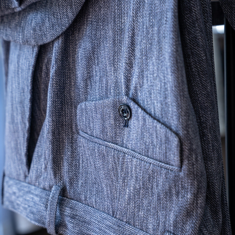 A pair of dusty blue Circolo 1901 trousers hanging upside down. Sakks Menswear Made-To-Measure Trousers available in Southampton.
