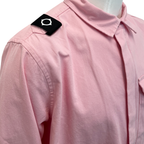 A close-up of a light pink collared shirt on a mannequin, featuring a black shoulder tab with a white circular emblem. MA.Strum Shirt Jacket available at Sakks Menswear in Southampton.