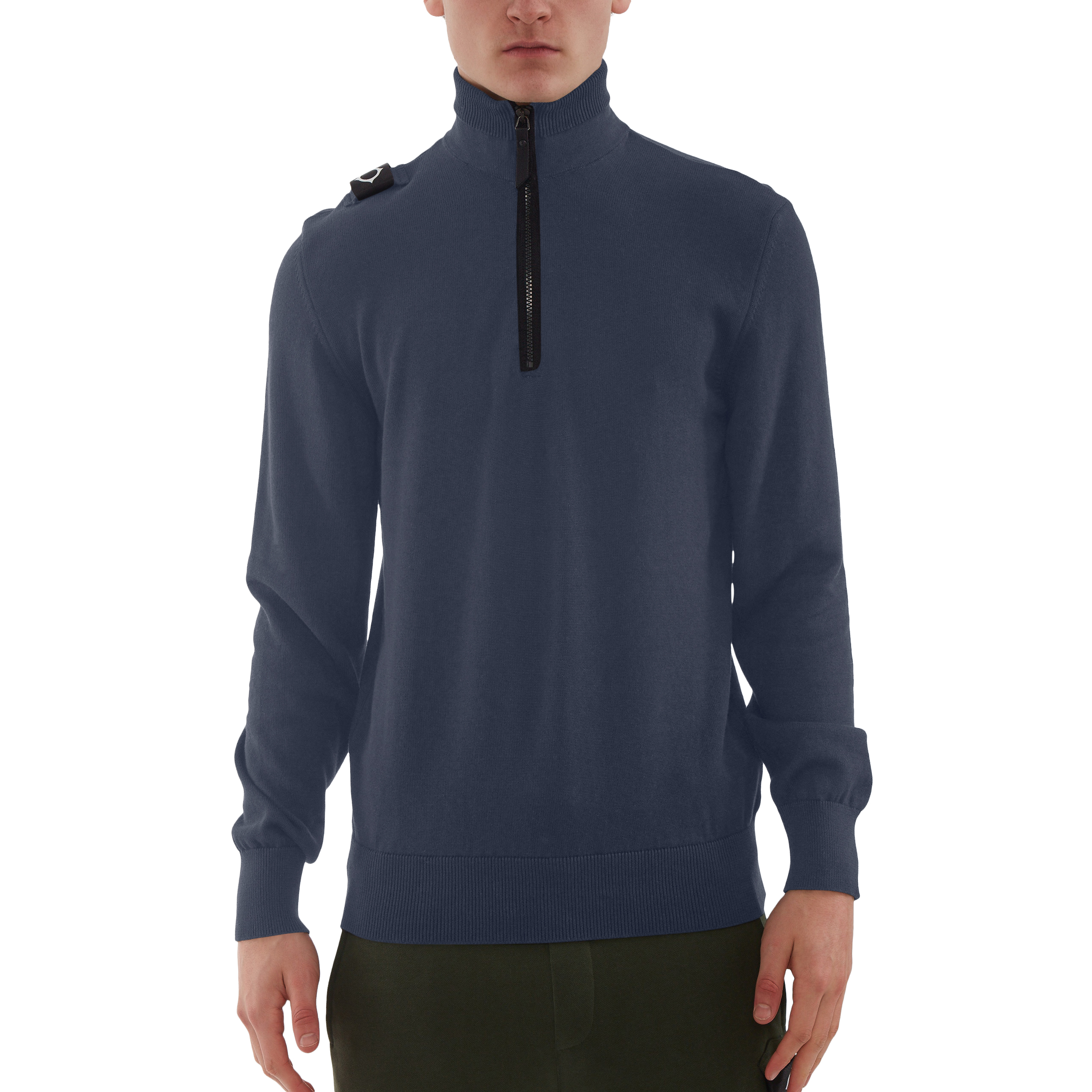 A man wearing a navy blue quarter-zip pullover sweater with a black zipper and a small black shoulder detail, shown against a plain white background. MA.Strum Knitwear available at Sakks Menswear in Southampton.