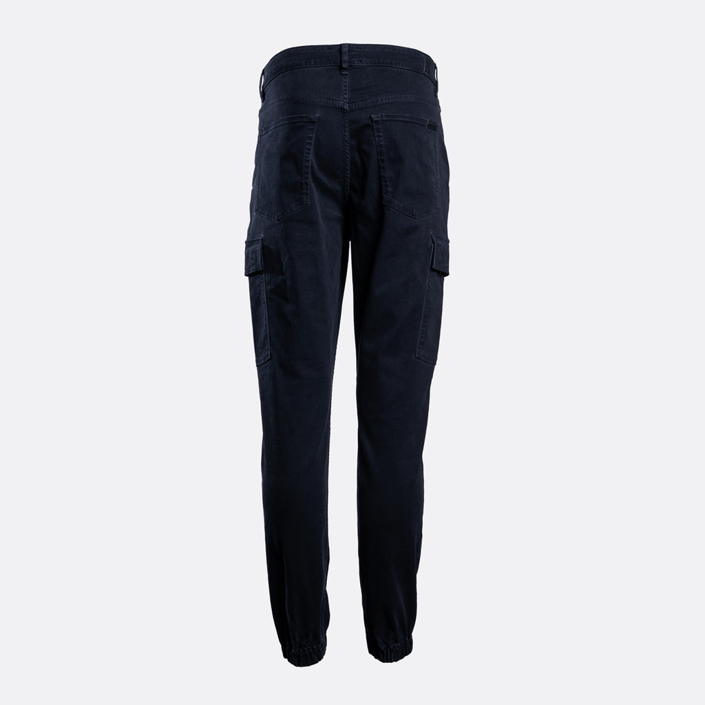 Dark navy blue cargo pants shown from the back, featuring side cargo pockets and a relaxed straight-leg fit, on a light gray background. 7 For All Mankind Cargo Pants available at Sakks Menswear in Southampton.