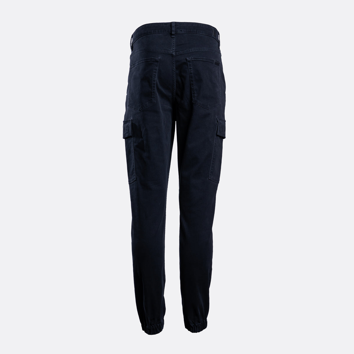Dark navy blue cargo pants shown from the back, featuring side cargo pockets and a relaxed straight-leg fit, on a light gray background. 7 For All Mankind Cargo Pants available at Sakks Menswear in Southampton.