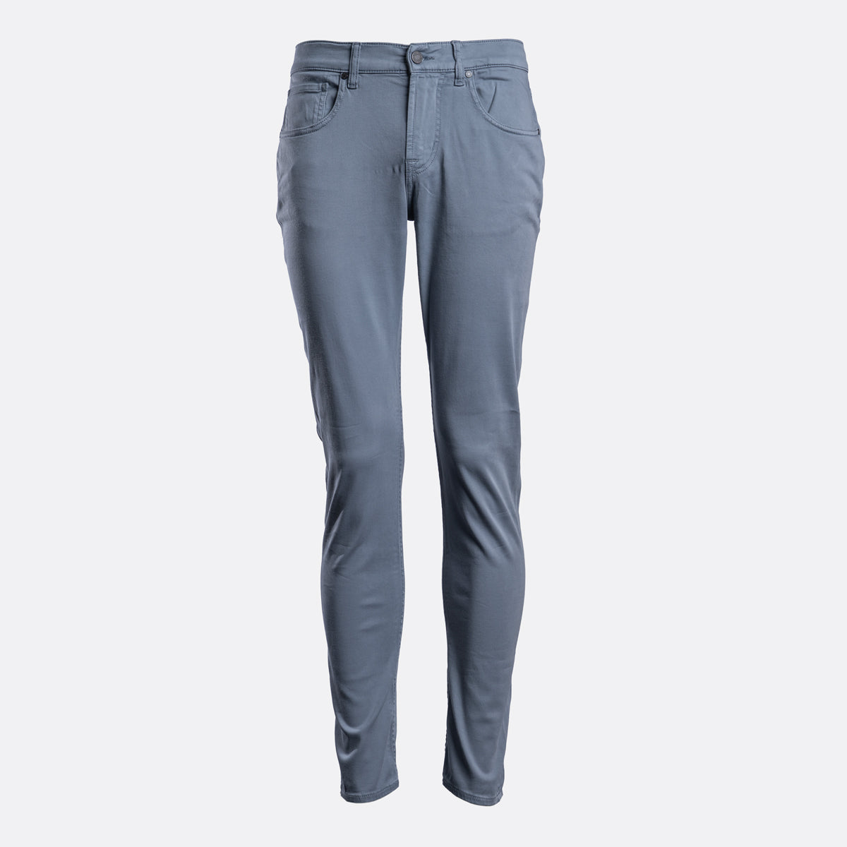 A pair of slim-fit, straight-leg jeans in a muted slate blue color, displayed on a clean, light gray background. 7 For All Mankind Chinos available at Sakks Menswear in Southampton.