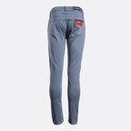 A pair of slim-fit blue jeans shown from the back, featuring a dark waistband patch and a red brand label on the right pocket, set against a plain light gray background. 7 For All Mankind Chinos available at Sakks Menswear in Southampton.