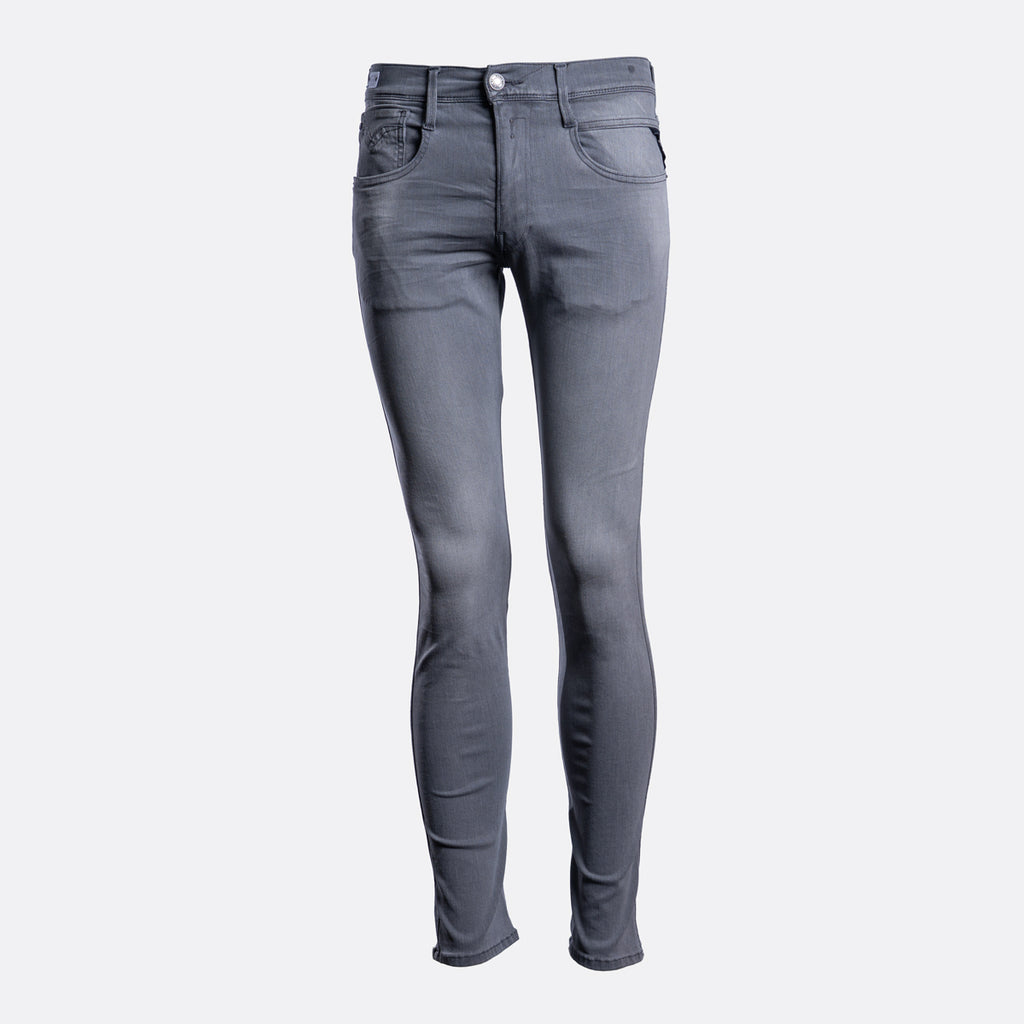A pair of slim-fit gray denim jeans shown from the front on a light gray background. Replay Jeans available at Sakks Menswear in Southampton.
