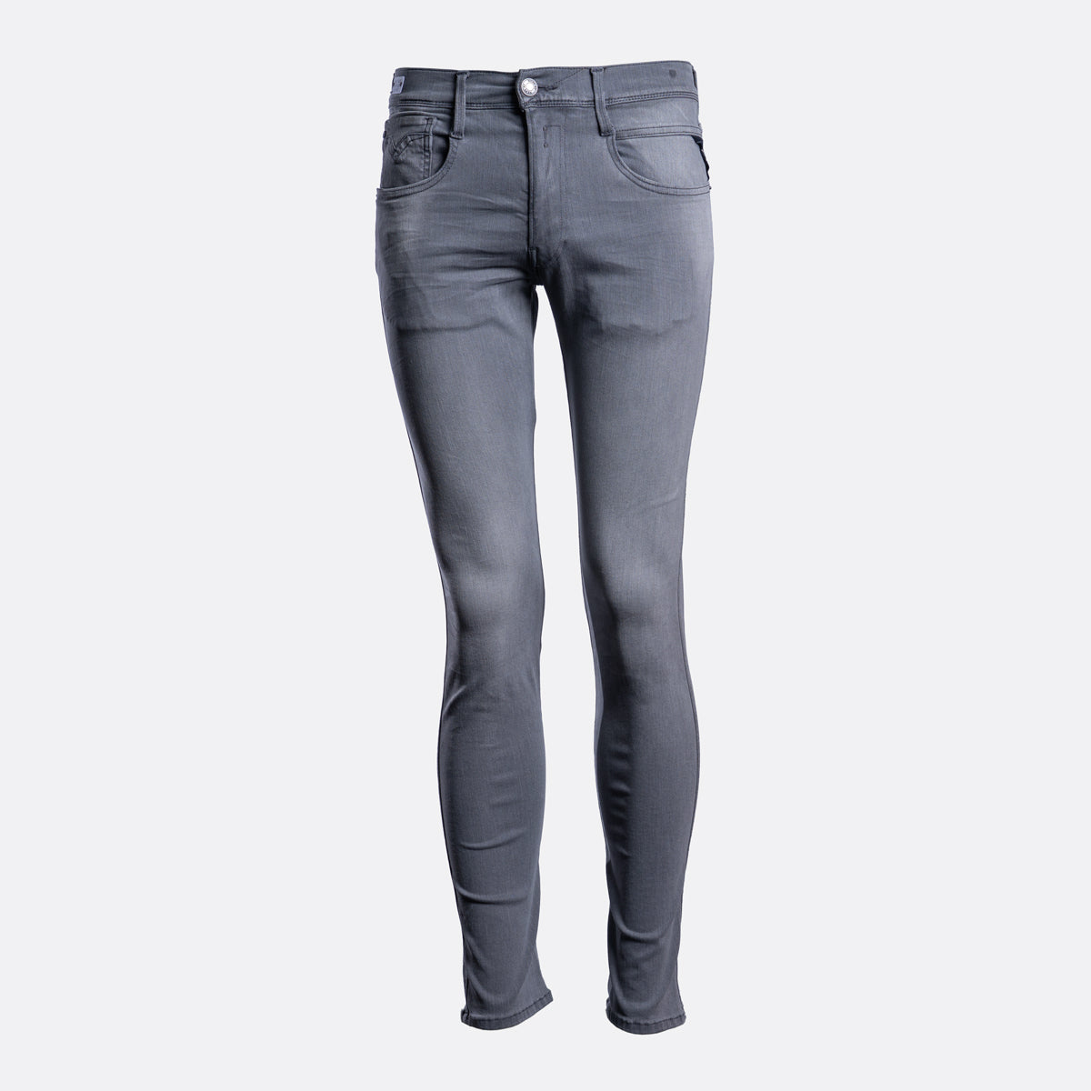 A pair of slim-fit gray denim jeans shown from the front on a light gray background. Replay Jeans available at Sakks Menswear in Southampton.