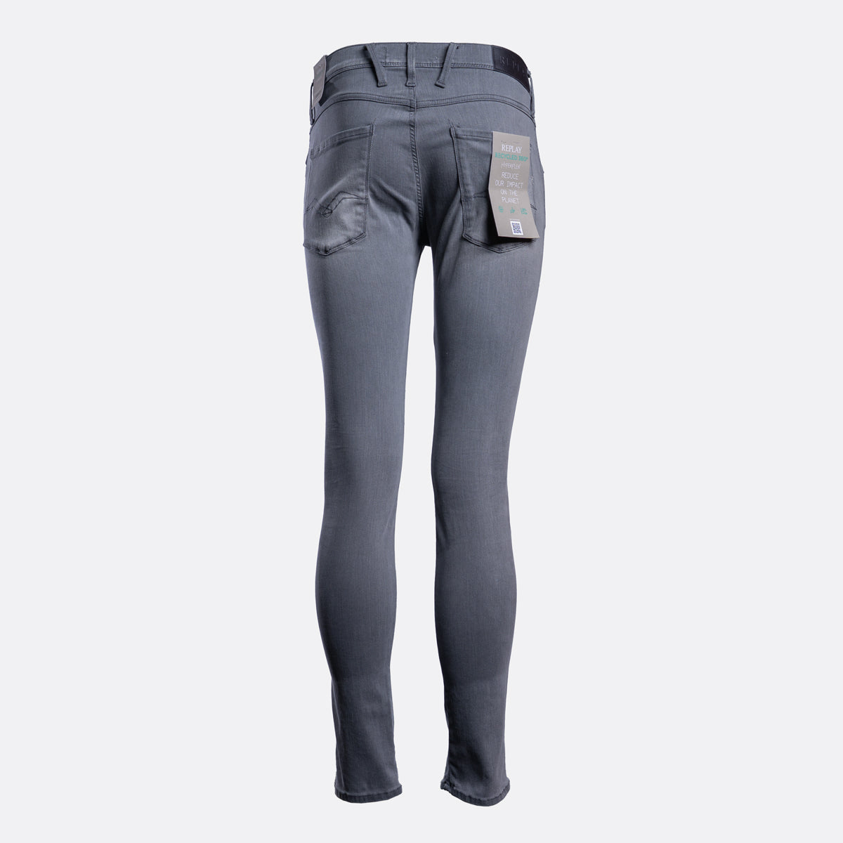 A pair of slim-fit gray jeans shown from the back, featuring a dark waistband, belt loops, and a paper tag still attached to the back pocket, set against a plain light gray background. Replay Jeans available at Sakks Menswear in Southampton.