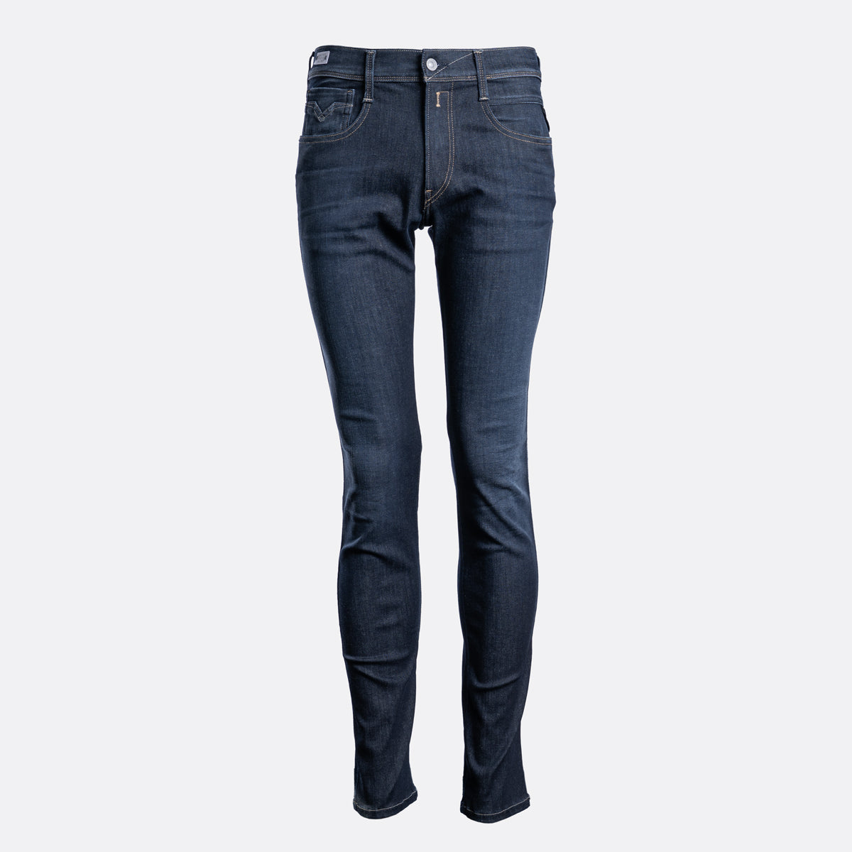A pair of slim-fit dark blue denim jeans shown on a headless mannequin form against a light gray background. Replay Jeans available at Sakks Menswear in Southampton.