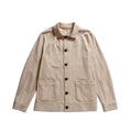 A light beige utility jacket with a pointed collar, dark buttons, and two front patch pockets, displayed flat against a white background. Circolo 1901 Shirt Jacket available at Sakks Menswear in Southampton.