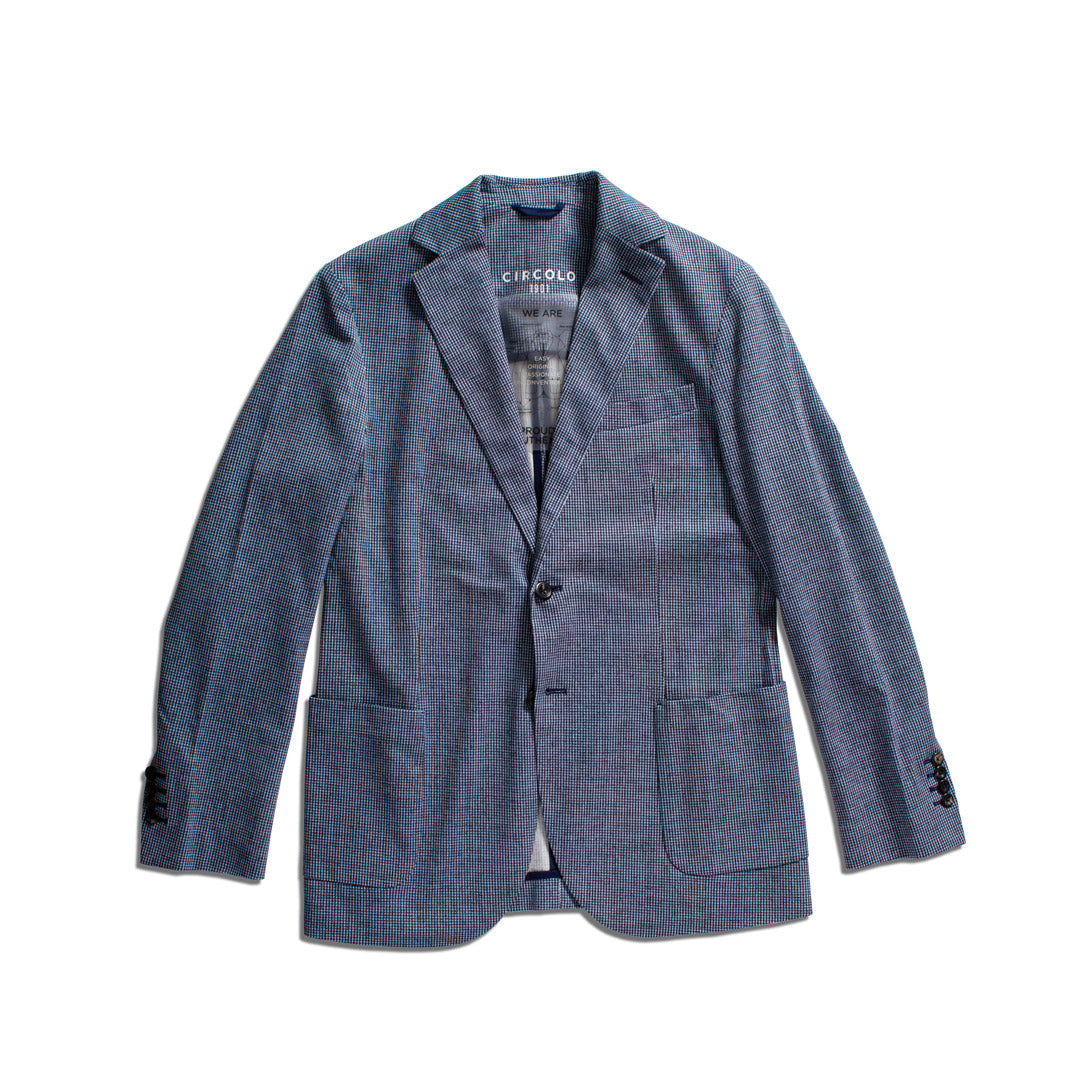 A blue textured blazer jacket by Circolo Roma, featuring a two-button front, notch lapels, and front flap pockets, laid flat against a white background. Circolo 1901 Blazer available at Sakks Menswear in Southampton.