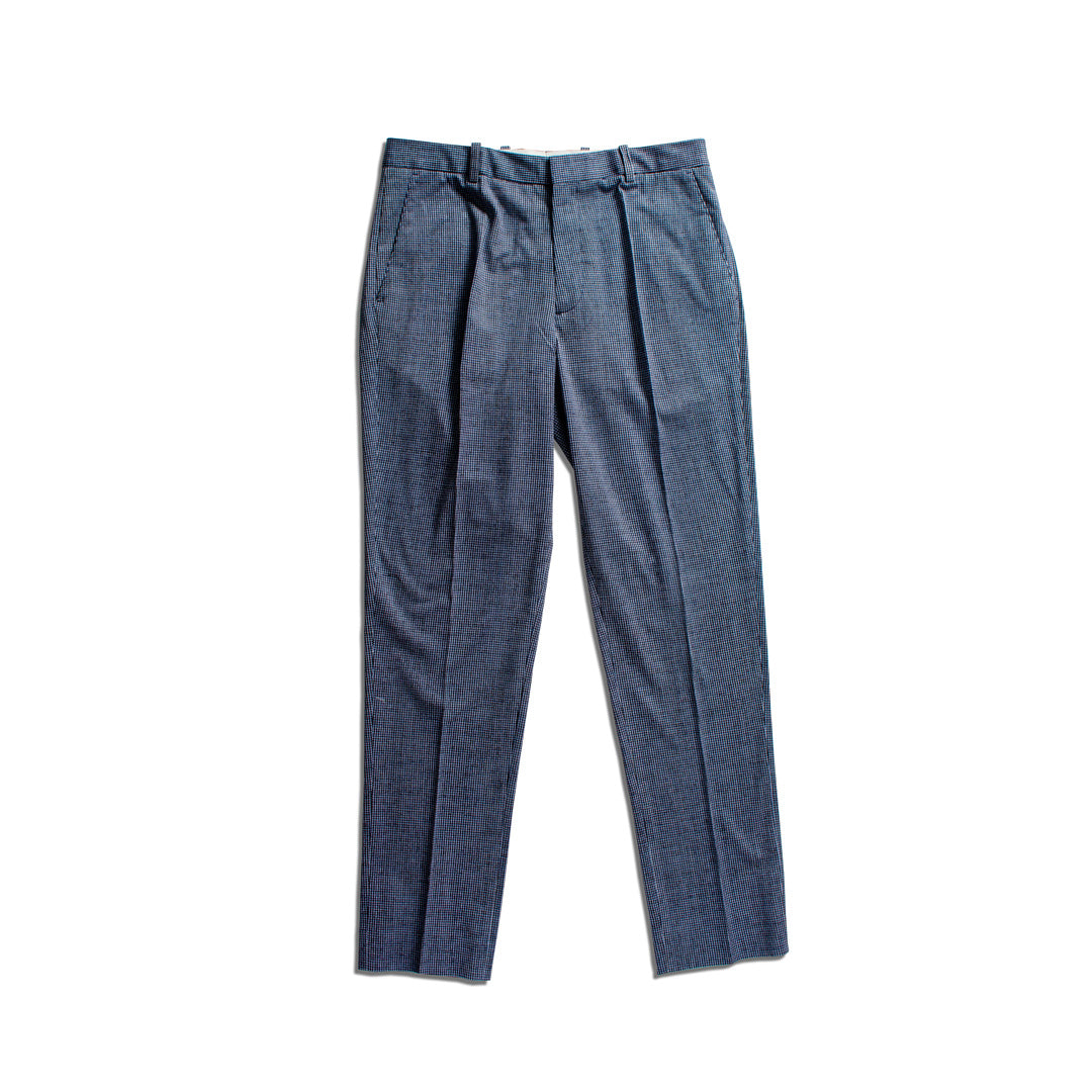 A pair of blue pleated trousers laid flat against a solid white background. Circolo 1901 Trousers available at Sakks Menswear in Southampton.