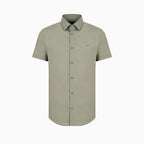A short-sleeve button-down shirt in a muted sage green color, featuring a small embroidered bird logo on the left chest, displayed on a clean white background. Emporio Armani Short Sleeved Shirt. Sakks Menswear Southampton.