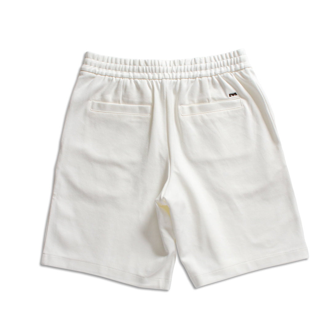 White cotton shorts with an elastic waistband, two back patch pockets, and a small black Emporio Armani logo on the upper right side, shown against a plain white background. Emporio Armani Shorts. Sakks Menswear Southampton.