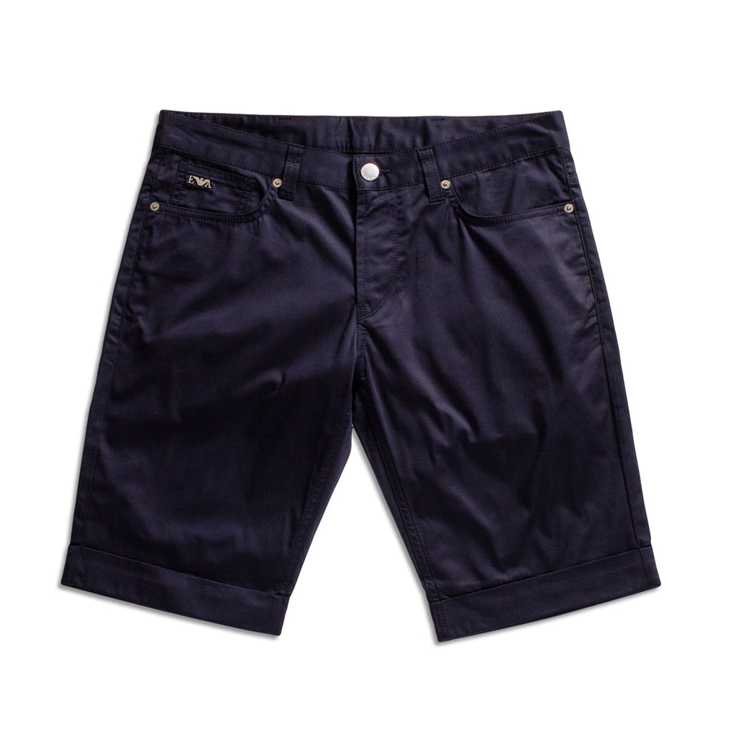 Dark navy blue denim shorts with rolled cuffs, shown flat on a white background. Emporio Armani Shorts. Sakks Menswear Southampton.