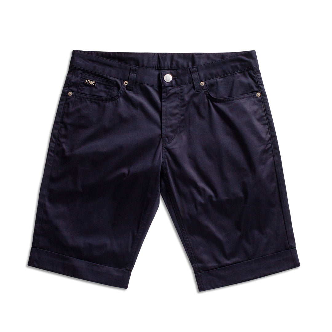 Dark navy blue denim shorts with rolled cuffs, shown flat on a white background. Emporio Armani Shorts. Sakks Menswear Southampton.