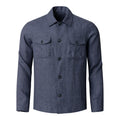 A men's long-sleeve button-up shirt in a textured blue-grey fabric, featuring a classic collar, dark buttons, and two buttoned chest flap pockets, shown against a plain white background. Eton Shirt Jacket available at Sakks Menswear in Southampton.
