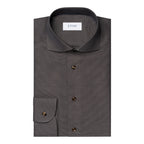 A dark grey textured dress shirt folded neatly, featuring a pointed collar, a chest pocket with a buttoned cuff, and dark brown buttons. The brand label 'ETON' is visible inside the collar. Eton Shirt available at Sakks Menswear in Southampton.