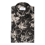 A folded long-sleeve button-up shirt by ETON, featuring a black base with a detailed beige and white floral print. Eton Shirt available at Sakks Menswear in Southampton.