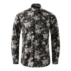 A long-sleeve button-up shirt with a black base and an all-over white floral and botanical print, displayed on a clean white background. Eton Shirt available at Sakks Menswear in Southampton.