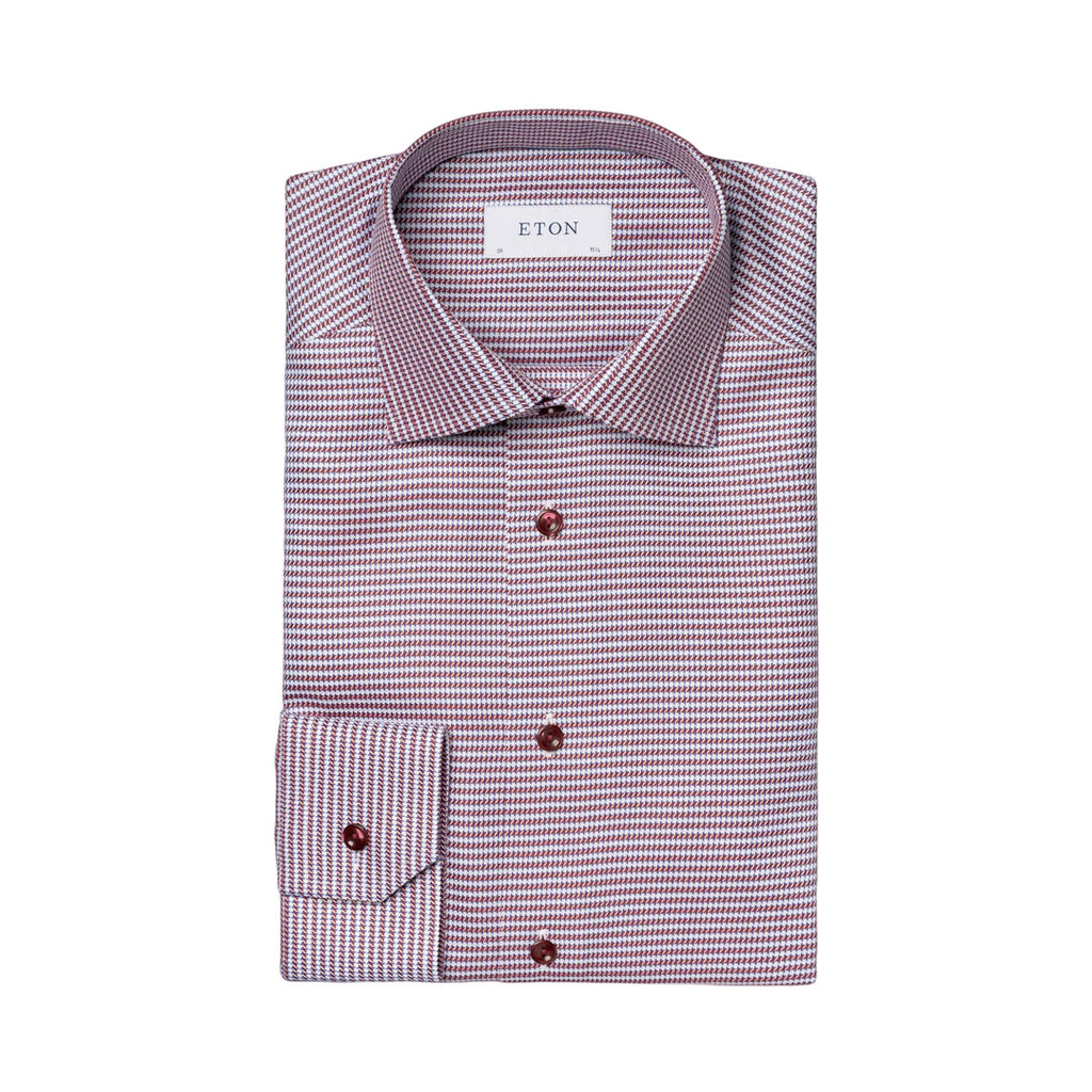 A folded ETON men's dress shirt with a fine micro-pattern of small pink and white dots, featuring dark brown buttons and a white neck label. Eton Shirt available at Sakks Menswear in Southampton.