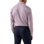 A man viewed from the back wearing a light pink and white striped long-sleeve dress shirt and navy blue trousers, against a plain white background. Eton Shirt available at Sakks Menswear in Southampton.